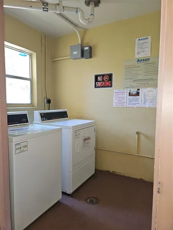 a utility room with a window dryer and washer