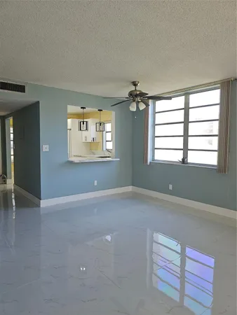 a view of an empty room with a window