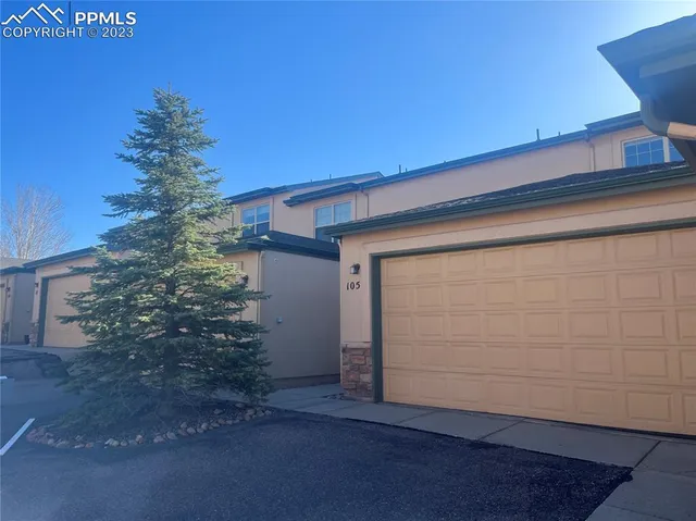 an empty room with windows and entrance