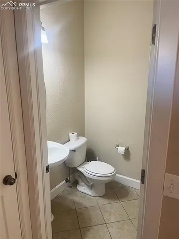 a bathroom with a granite countertop sink mirror and shower