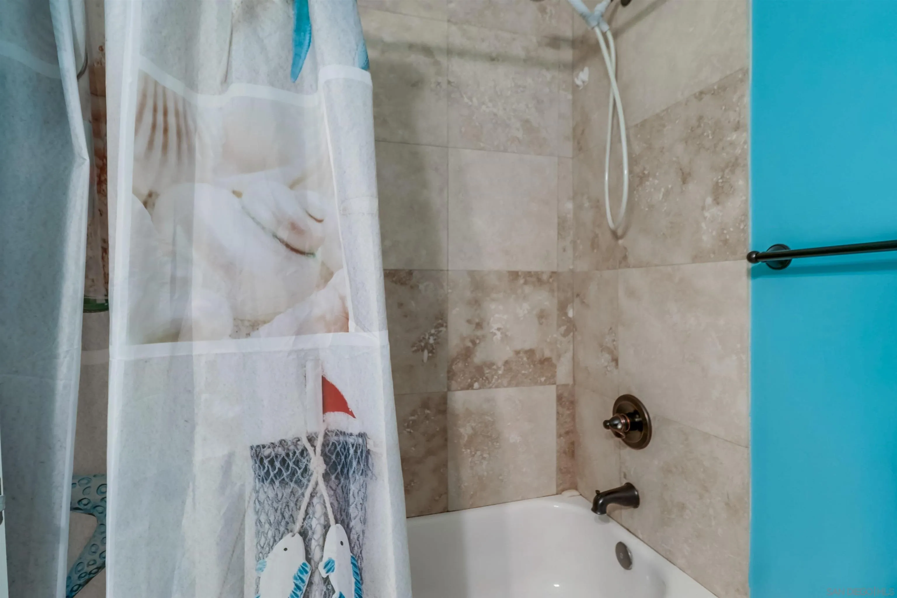 9833 St George Street Spring Valley, CA 91977 - Photo 14 of 19 a bathroom with a bathtub and shower