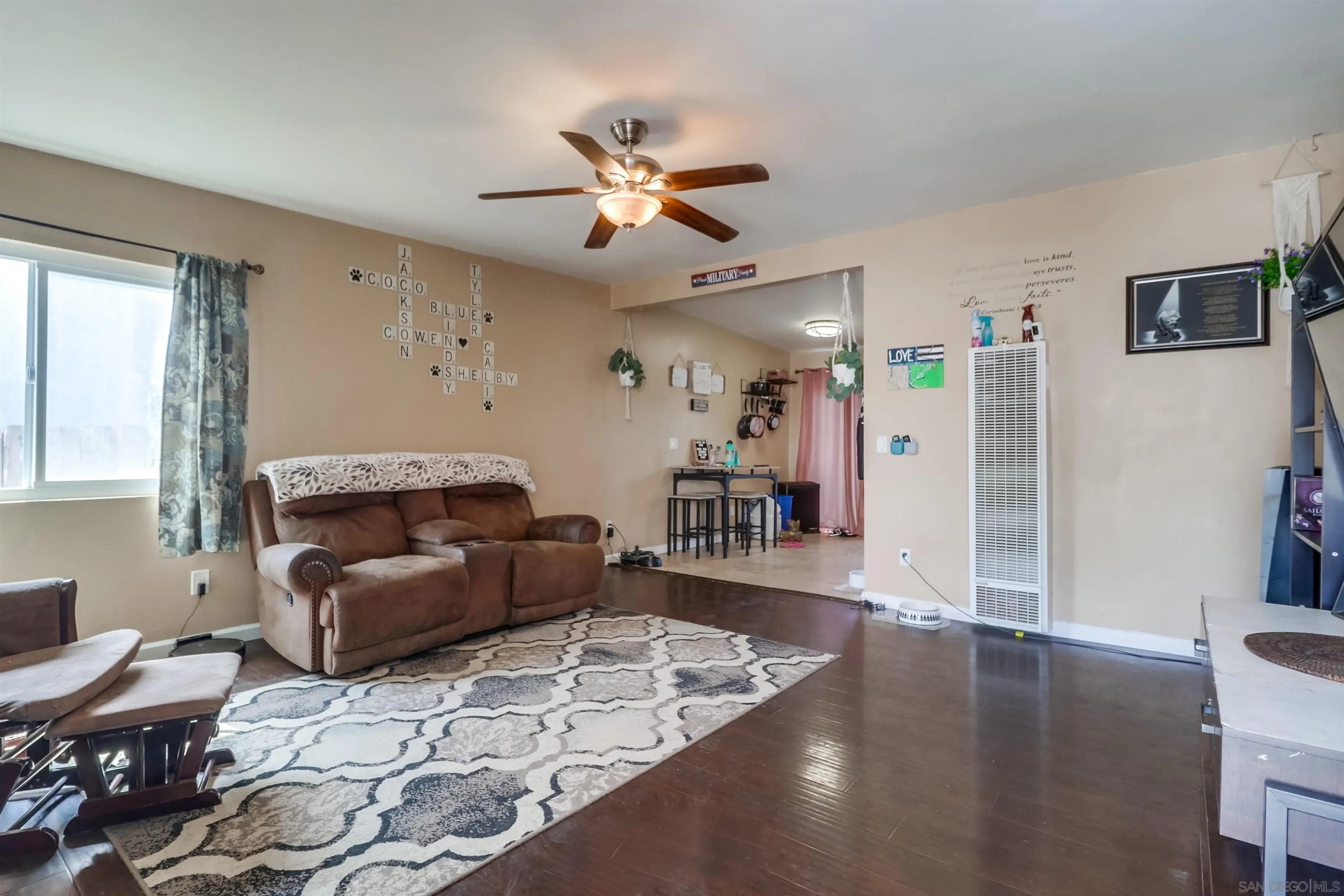 9833 St George Street Spring Valley, CA 91977 - Photo 3 of 19 a living room with furniture and a wooden floor