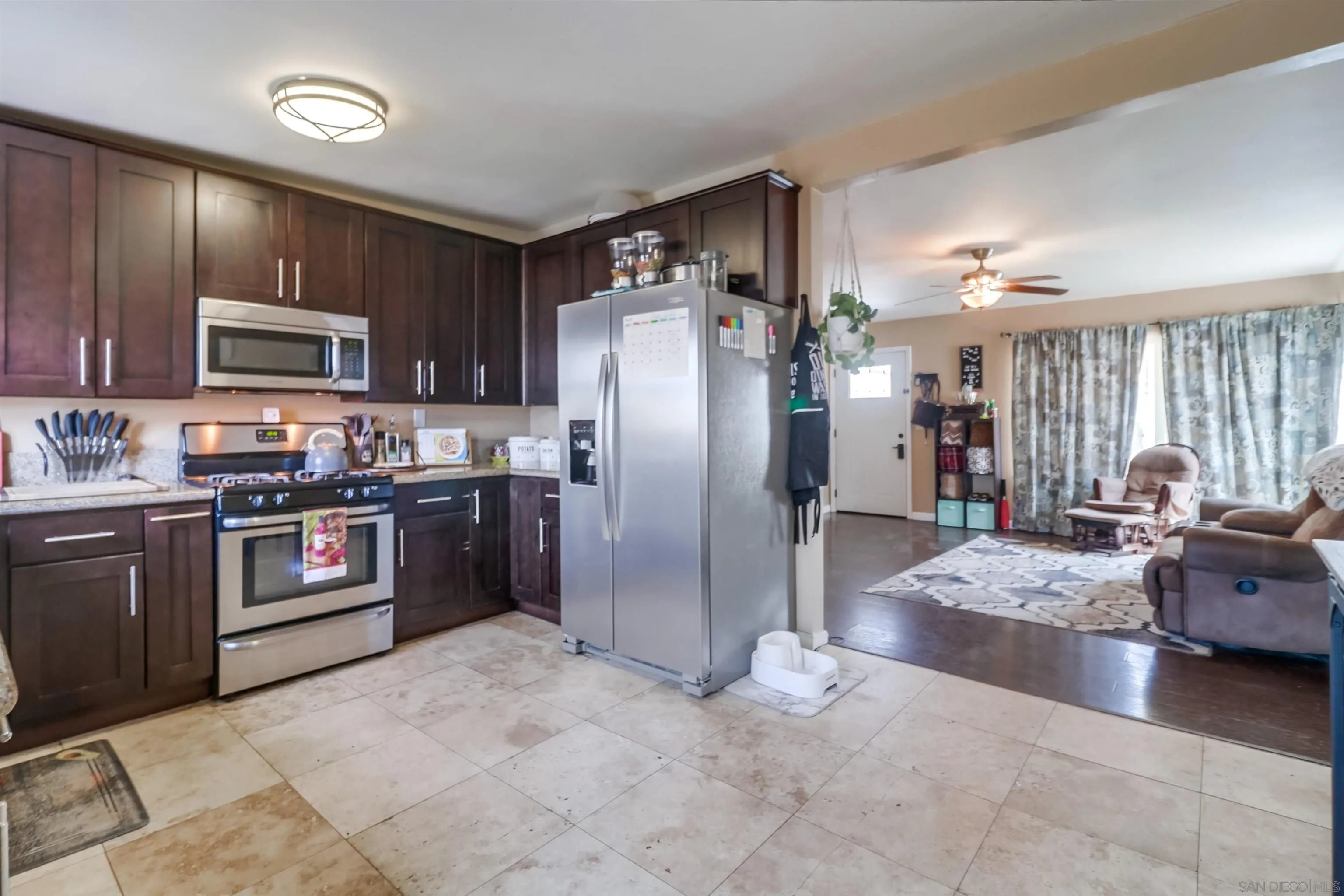 9833 St George Street Spring Valley, CA 91977 - Photo 10 of 19 a large kitchen with stainless steel appliances lots of counter top space