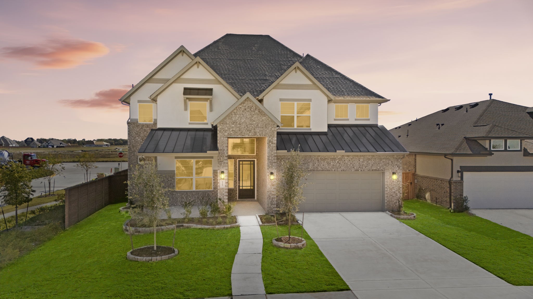 9103 Basilica Lane Manvel, TX 77578 - Photo 2 of 50 a front view of house with yard and mountain