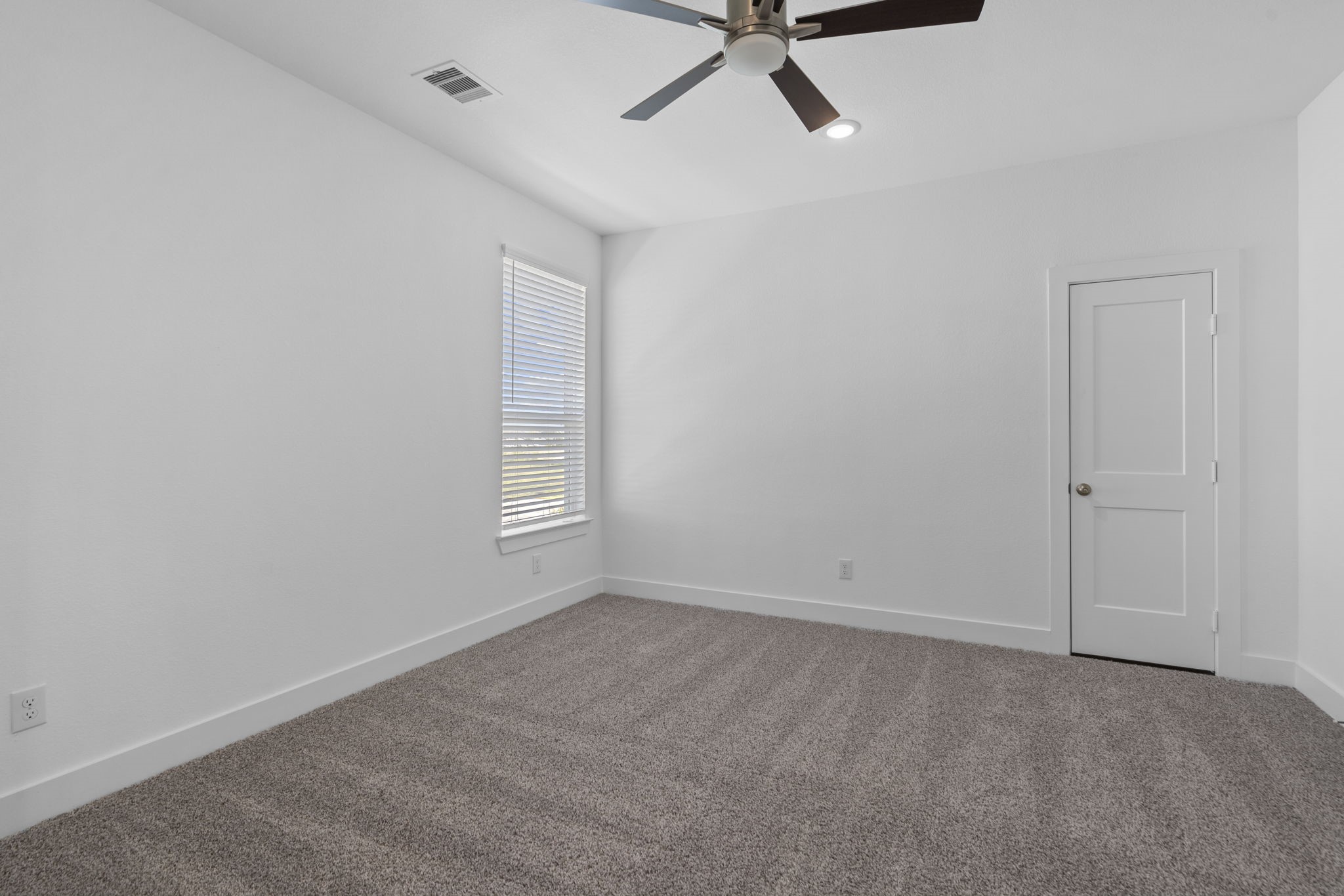 9103 Basilica Lane Manvel, TX 77578 - Photo 29 of 50 a view of room with hardwood floor and window