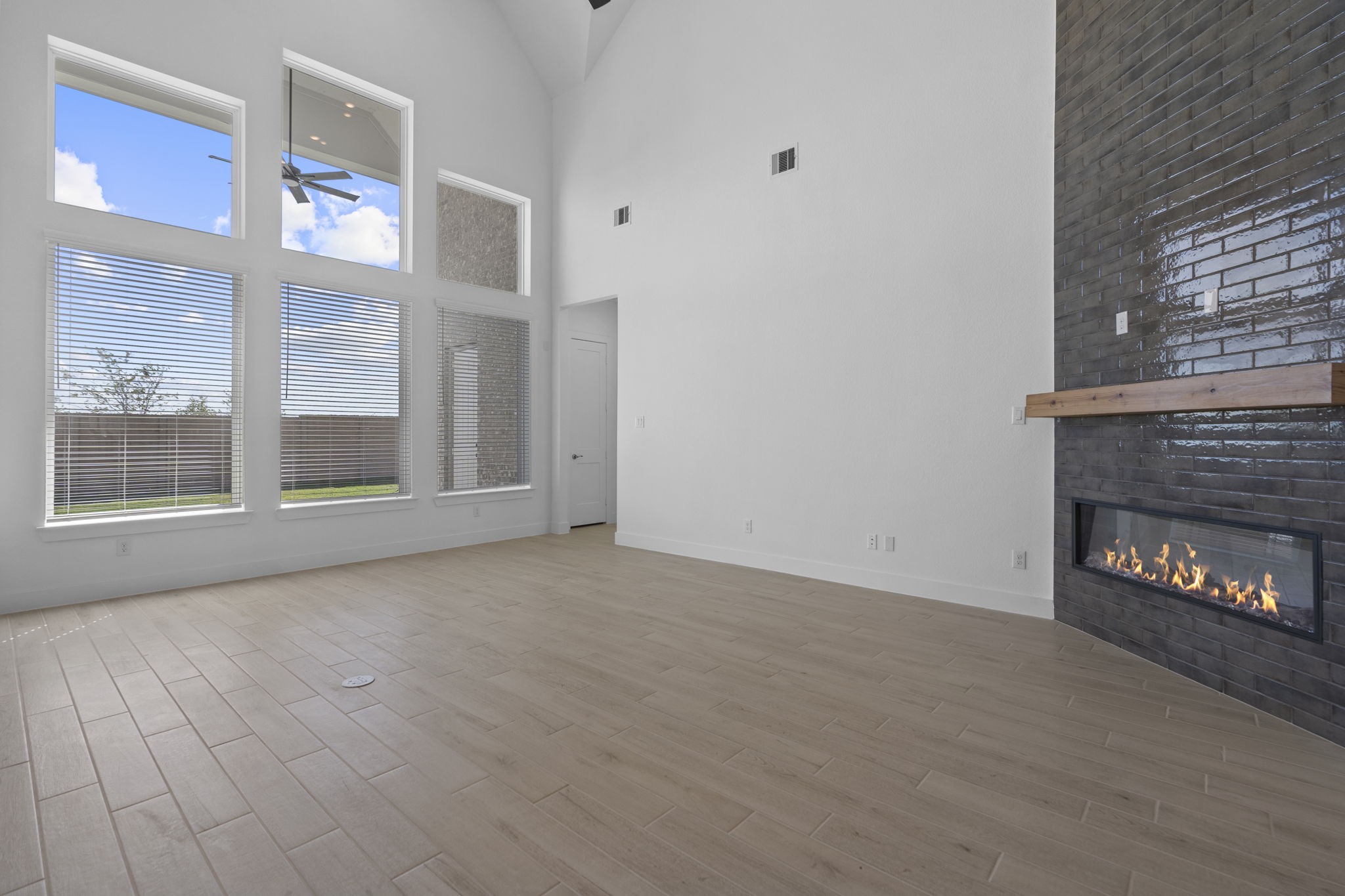 9103 Basilica Lane Manvel, TX 77578 - Photo 9 of 50 a view of an entrance and room with a fireplace