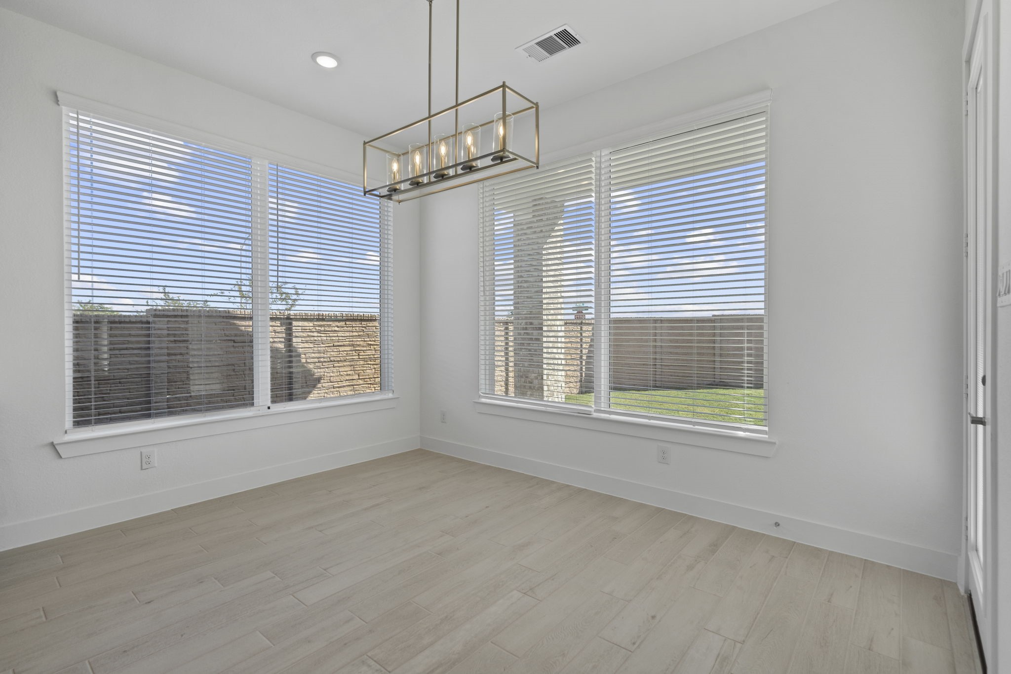 9103 Basilica Lane Manvel, TX 77578 - Photo 10 of 50 an empty room with windows and entrance