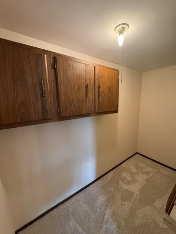 an empty room with a wooden door