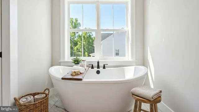 a bathroom with a sink and a window
