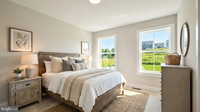 a bedroom with a bed and a couch