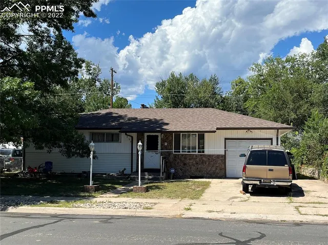 a car parked in front of a house