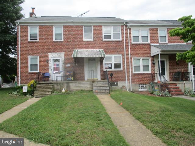 122 Hampshire Road Baltimore, MD 21221 - Photo 1 of 22 a front view of a house with a yard