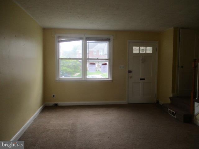 122 Hampshire Road Baltimore, MD 21221 - Photo 2 of 22 an empty room with a window