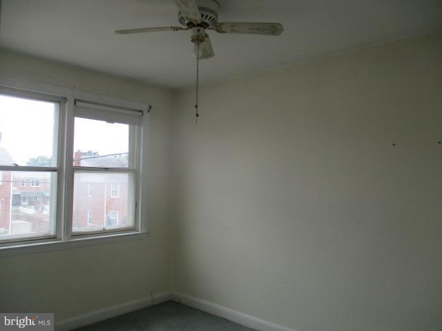 122 Hampshire Road Baltimore, MD 21221 - Photo 12 of 22 an empty room with a window