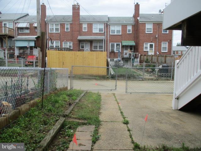 122 Hampshire Road Baltimore, MD 21221 - Photo 22 of 22 a view of a brick building with many windows