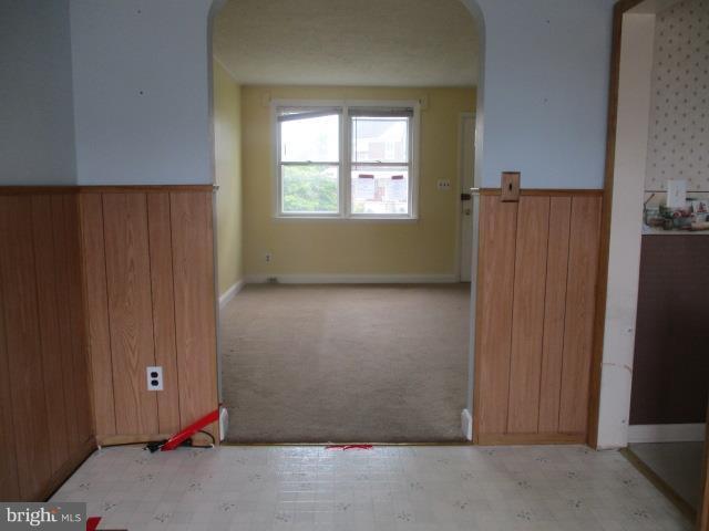 122 Hampshire Road Baltimore, MD 21221 - Photo 5 of 22 an empty room with windows and closet