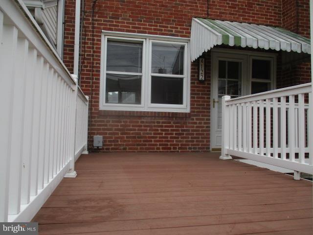 122 Hampshire Road Baltimore, MD 21221 - Photo 9 of 22 a view of a house with wooden fence
