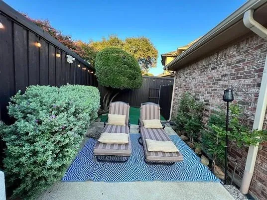 a view of backyard with seating space