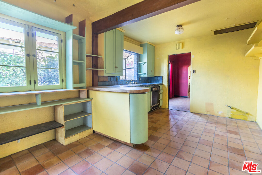 2371 Midvale Avenue Los Angeles, CA 90064 - Photo 13 of 33 a view of a kitchen with kitchen island a counter top space and cabinets