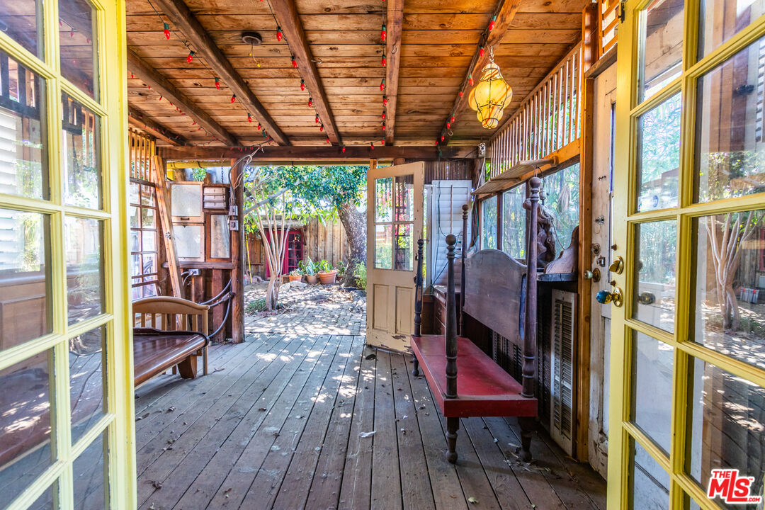 2371 Midvale Avenue Los Angeles, CA 90064 - Photo 14 of 33 a view of a porch with furniture and wooden floor