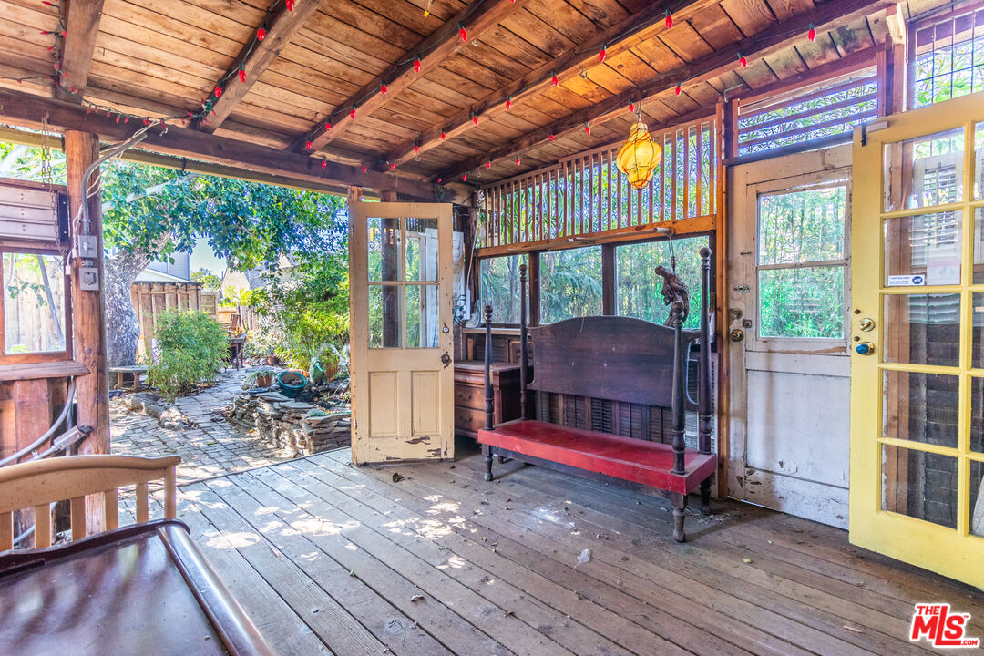 2371 Midvale Avenue Los Angeles, CA 90064 - Photo 15 of 33 a living room with furniture a wooden floor and next to a window