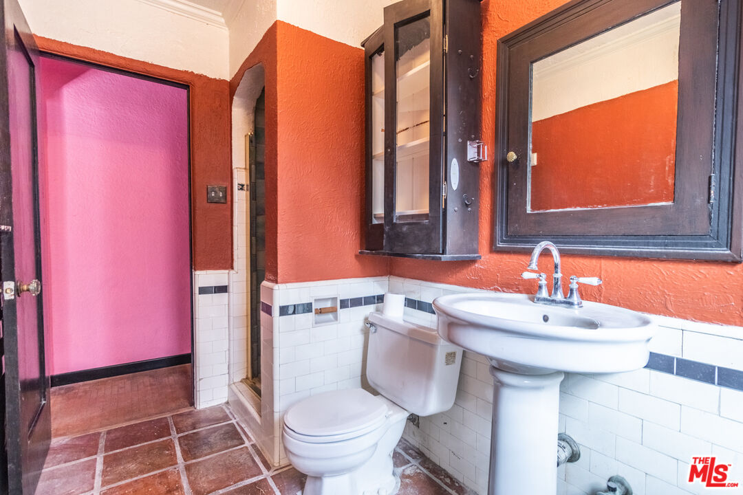 2371 Midvale Avenue Los Angeles, CA 90064 - Photo 18 of 33 a bathroom with a sink toilet and mirror