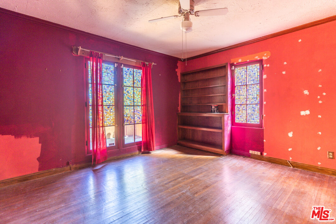 2371 Midvale Avenue Los Angeles, CA 90064 - Photo 22 of 33 a view of empty room with wooden floor and fan