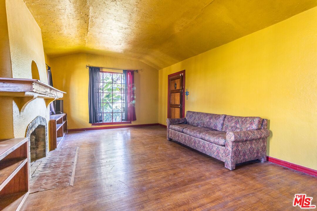 2371 Midvale Avenue Los Angeles, CA 90064 - Photo 9 of 33 a living room with furniture and a fireplace