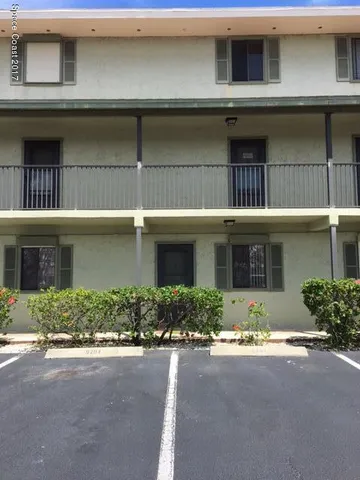a front view of a house with garage