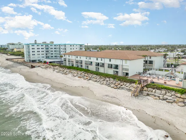 a view of swimming pool with outdoor seating and city view