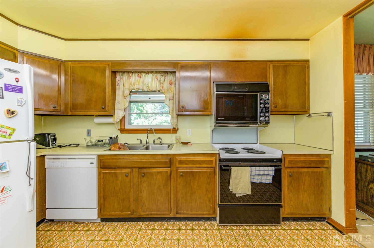 370 East Millstream Road Cream Ridge, NJ 08514 - Photo 18 of 54 a kitchen with stainless steel appliances a stove a sink and a microwave