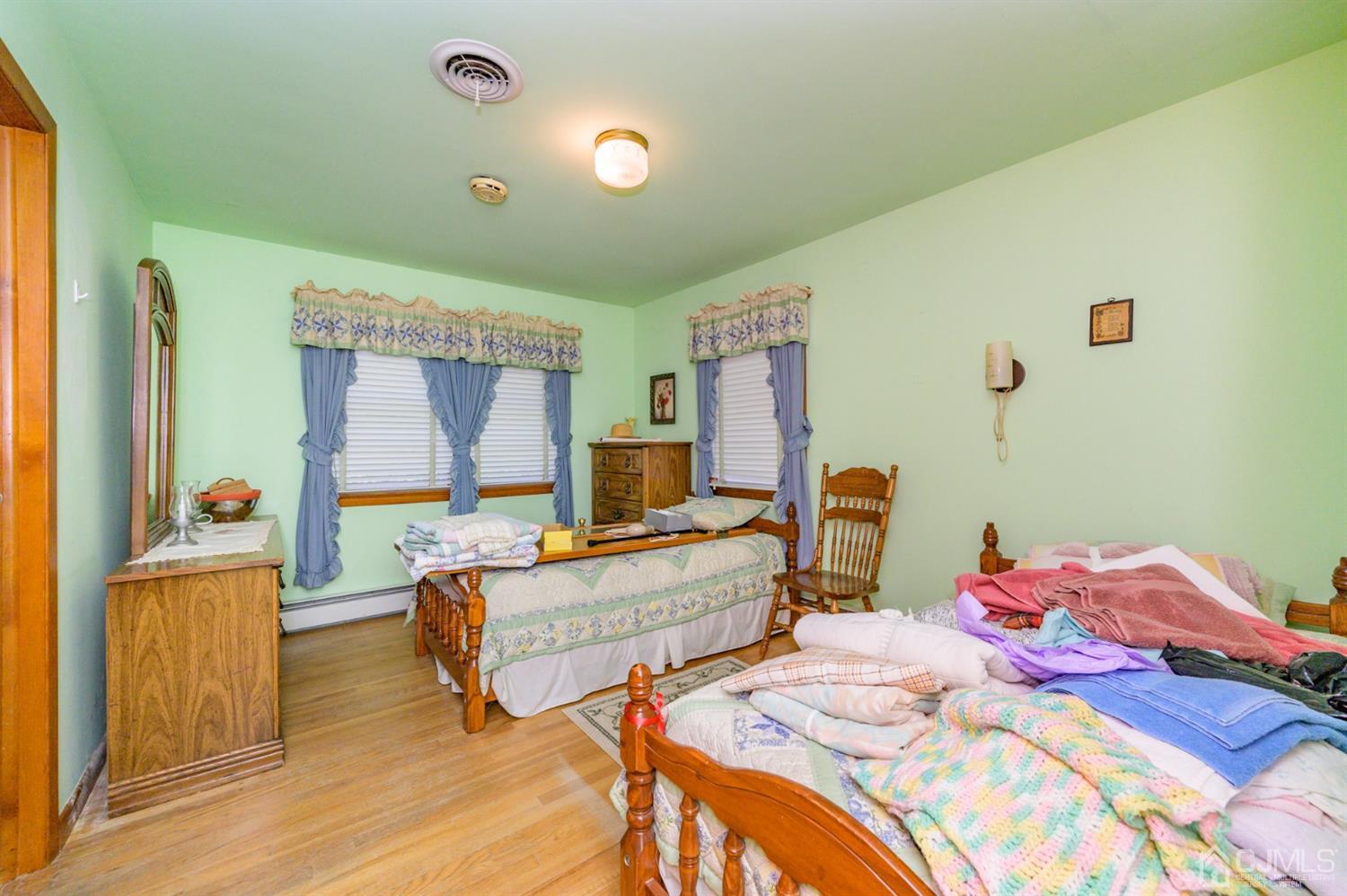 370 East Millstream Road Cream Ridge, NJ 08514 - Photo 22 of 54 a bedroom with two beds and a flat screen tv