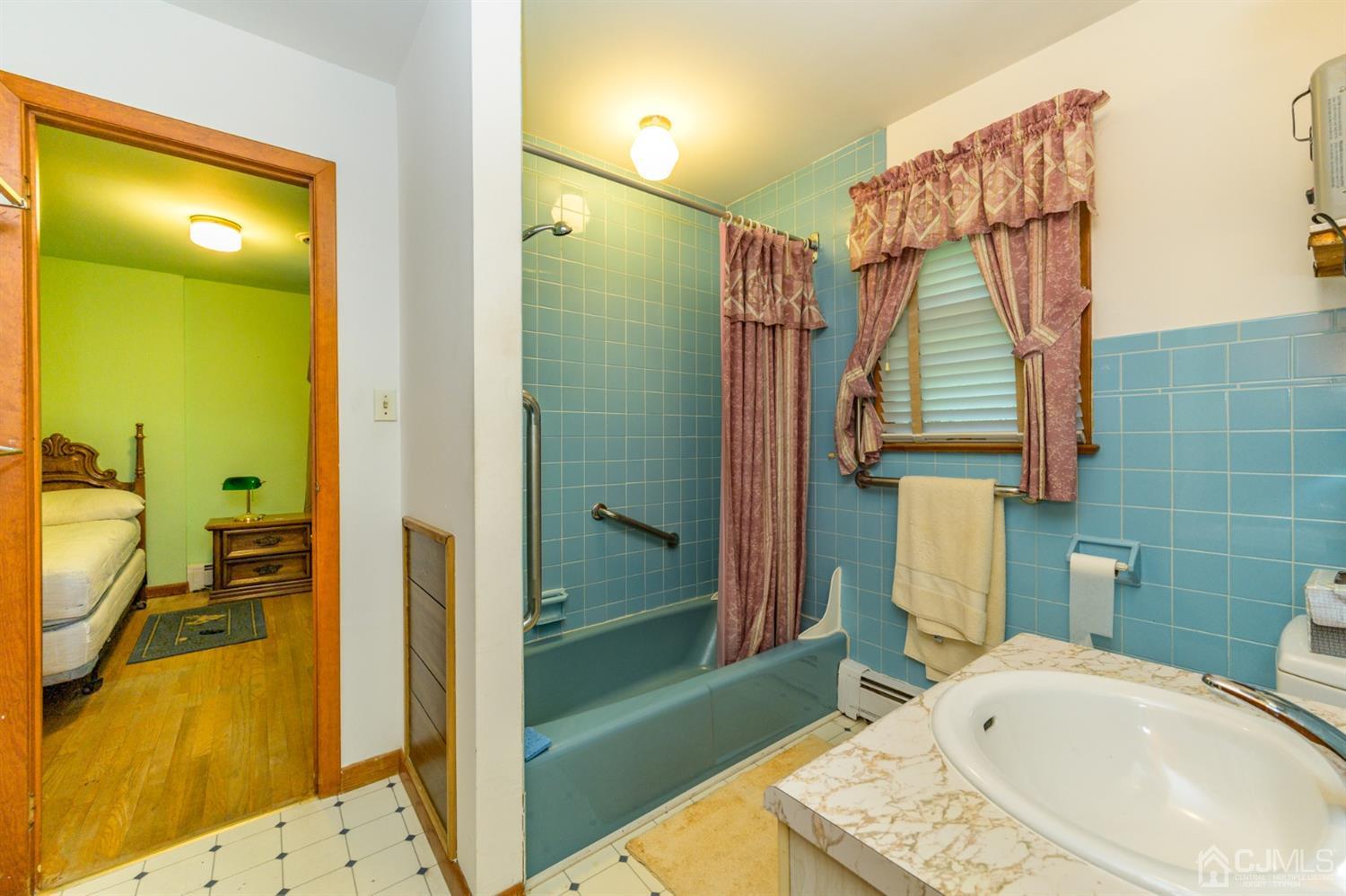 370 East Millstream Road Cream Ridge, NJ 08514 - Photo 24 of 54 a bathroom with a sink a toilet and shower