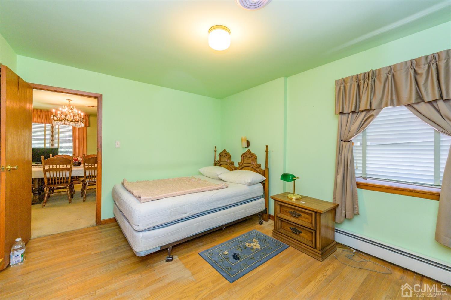 370 East Millstream Road Cream Ridge, NJ 08514 - Photo 27 of 54 a bedroom with a bed and a view of balcony
