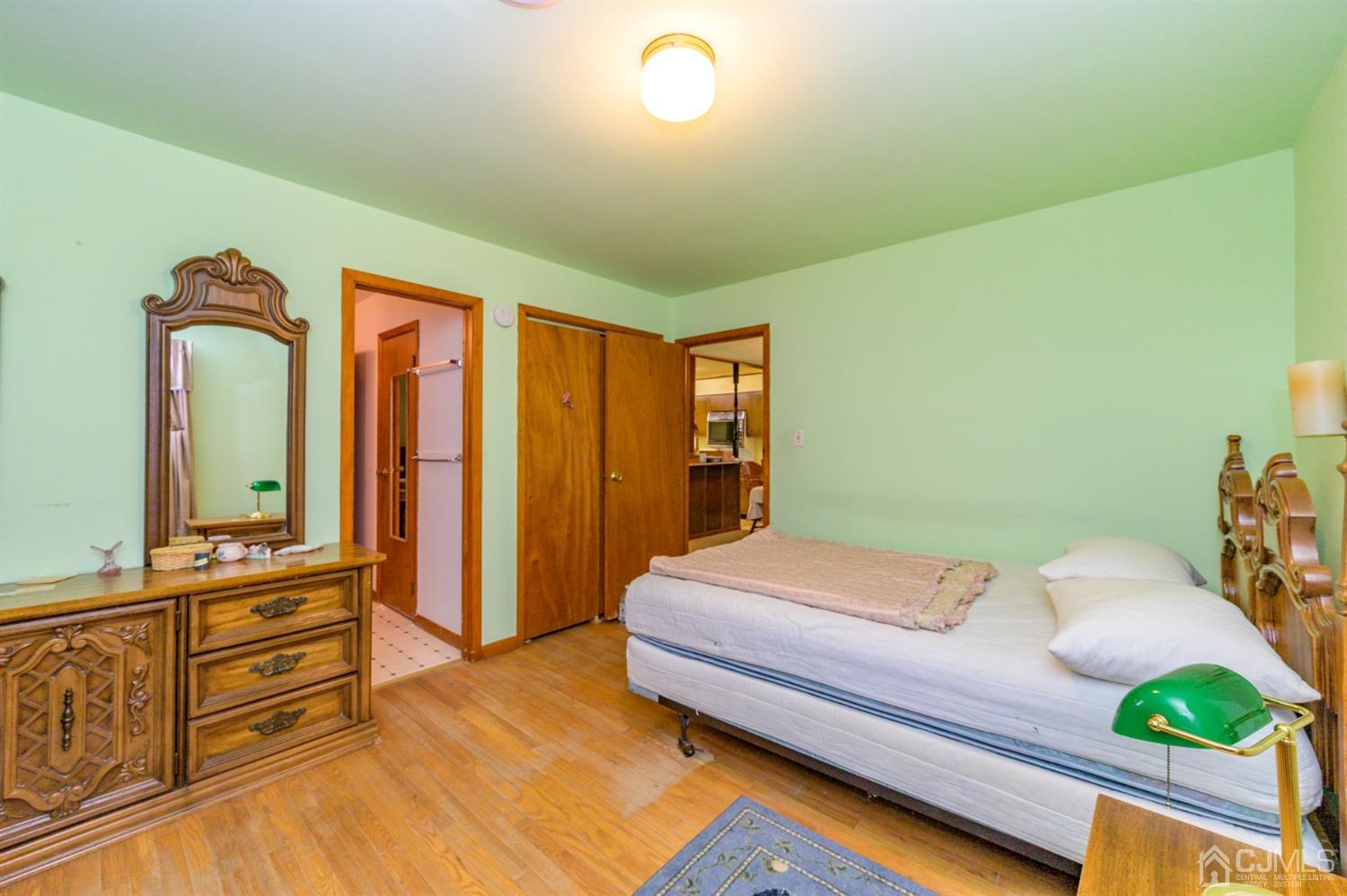 370 East Millstream Road Cream Ridge, NJ 08514 - Photo 28 of 54 a bedroom with a bed and a dresser