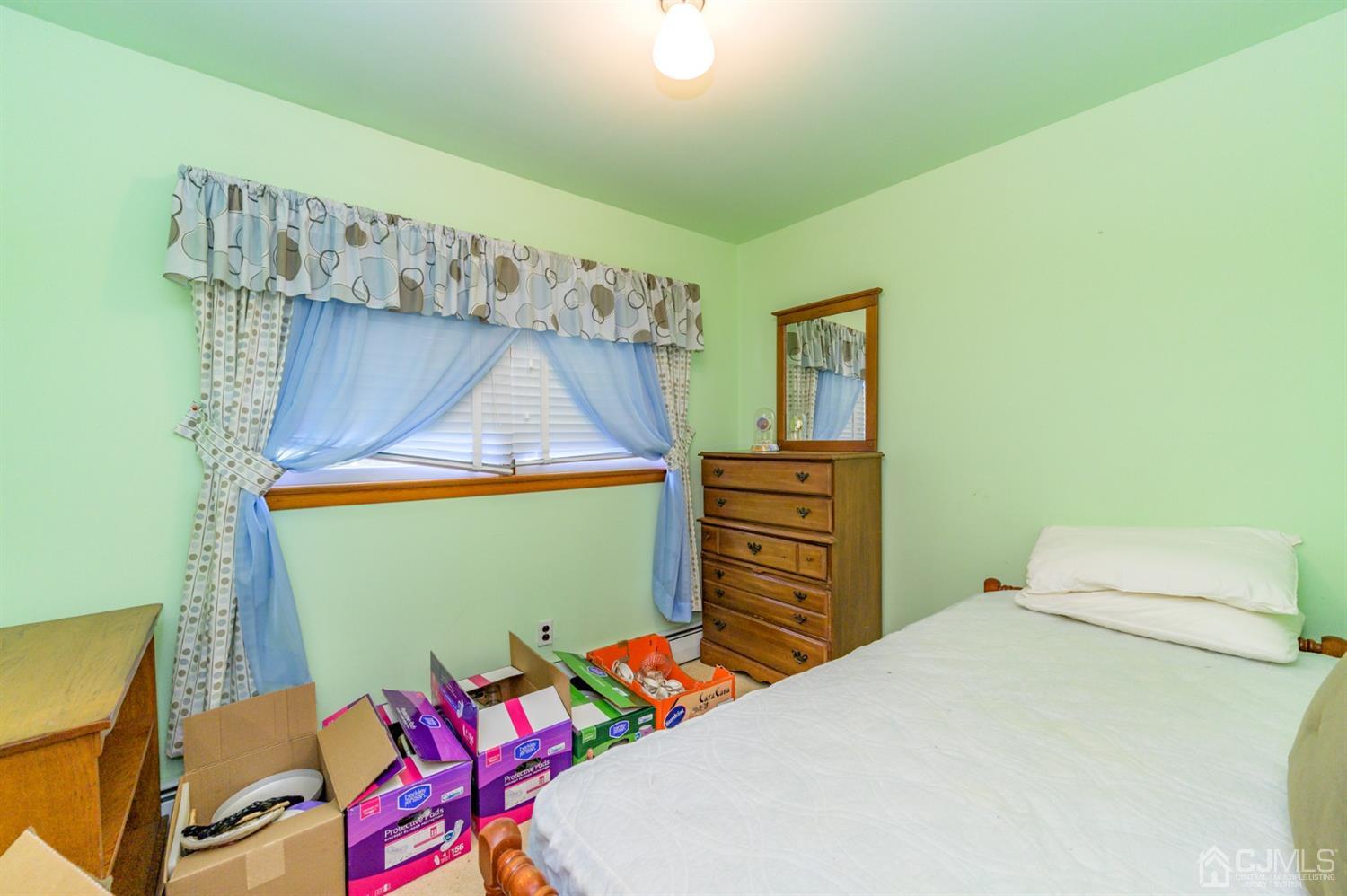370 East Millstream Road Cream Ridge, NJ 08514 - Photo 30 of 54 a bedroom with a bed and a dresser