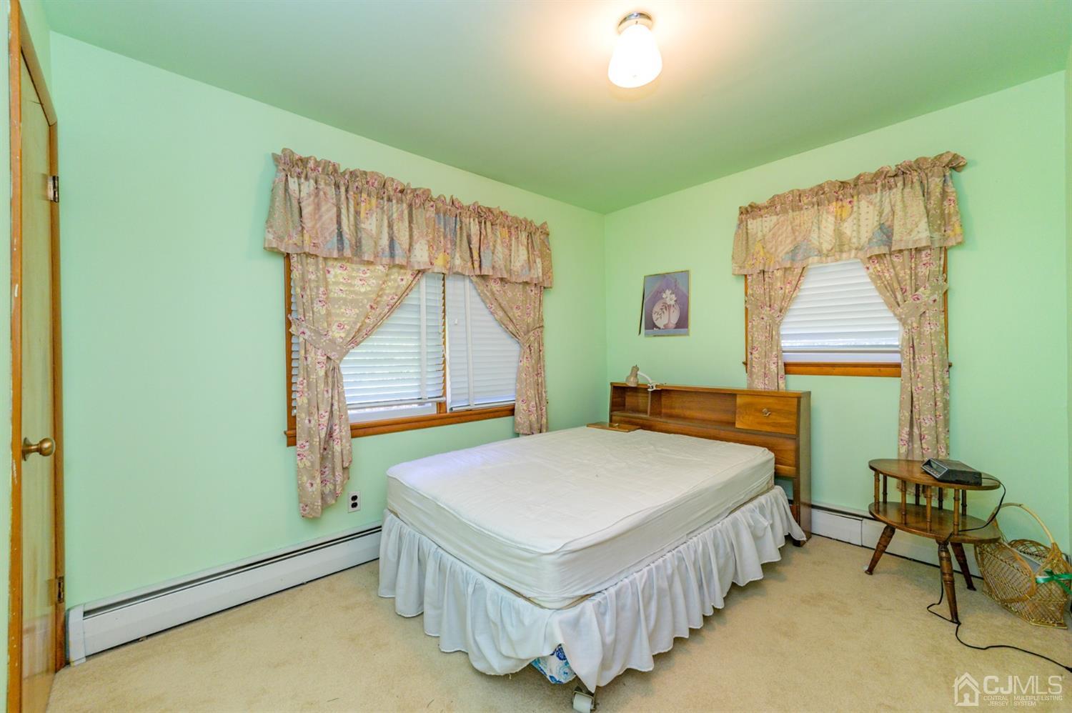 370 East Millstream Road Cream Ridge, NJ 08514 - Photo 32 of 54 a bedroom with a bed and a window