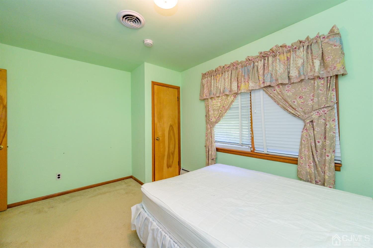 370 East Millstream Road Cream Ridge, NJ 08514 - Photo 34 of 54 a bedroom with a bed and a window