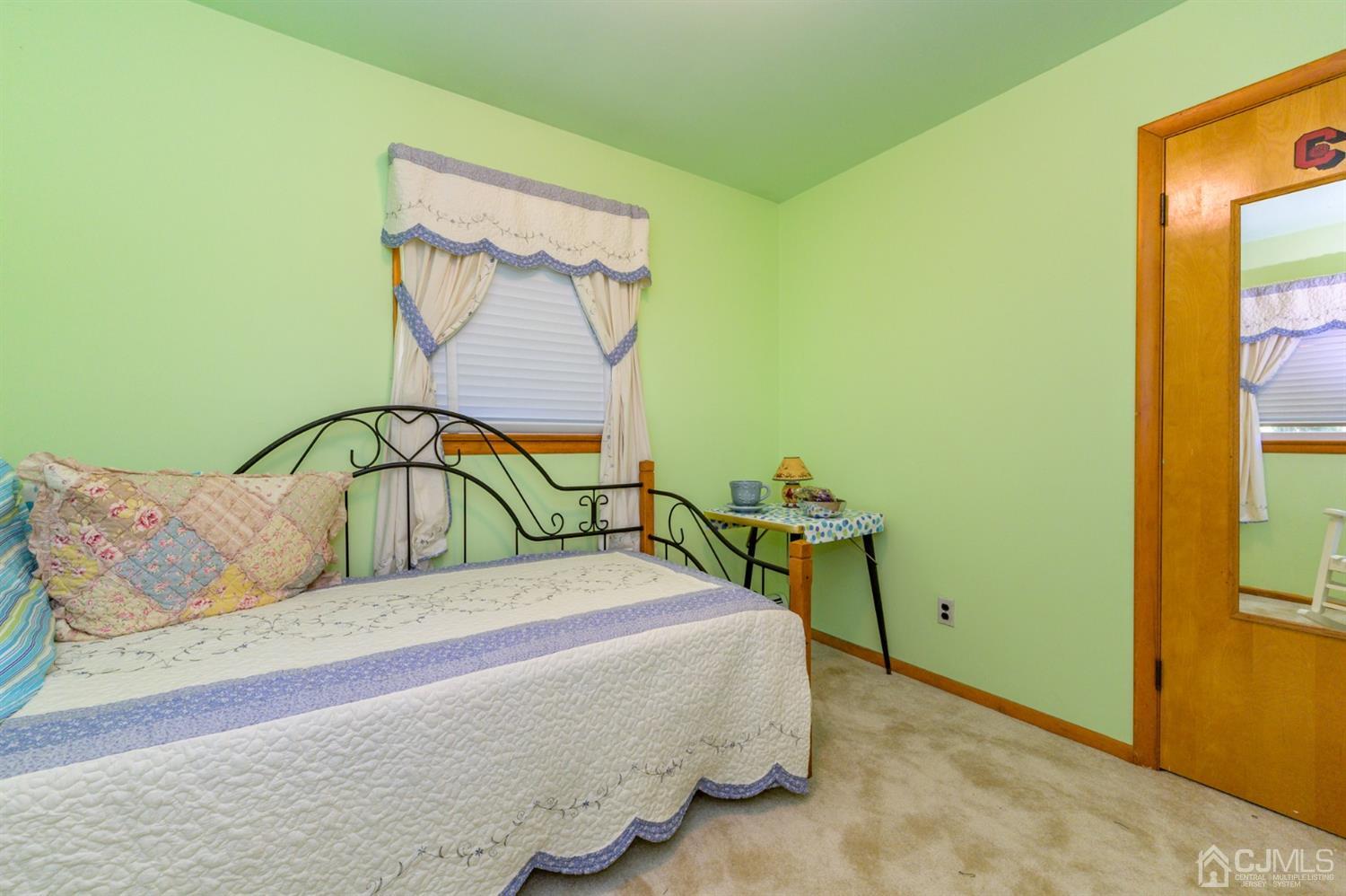 370 East Millstream Road Cream Ridge, NJ 08514 - Photo 37 of 54 a bedroom with a bed and with a wall painting