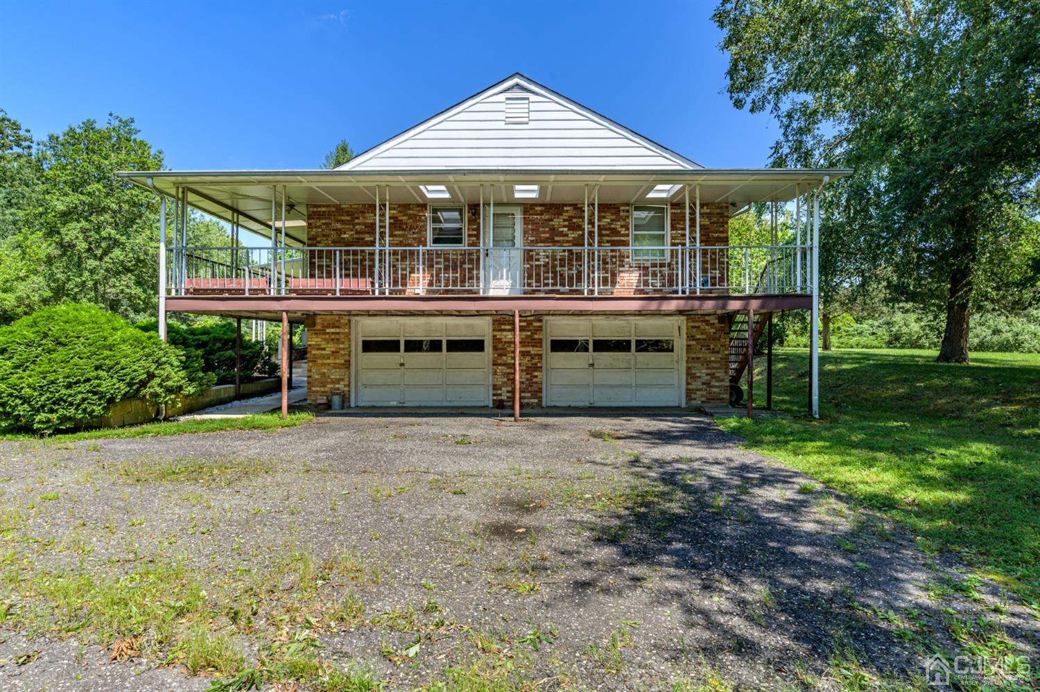370 East Millstream Road Cream Ridge, NJ 08514 - Photo 49 of 54 front view of a house with a yard
