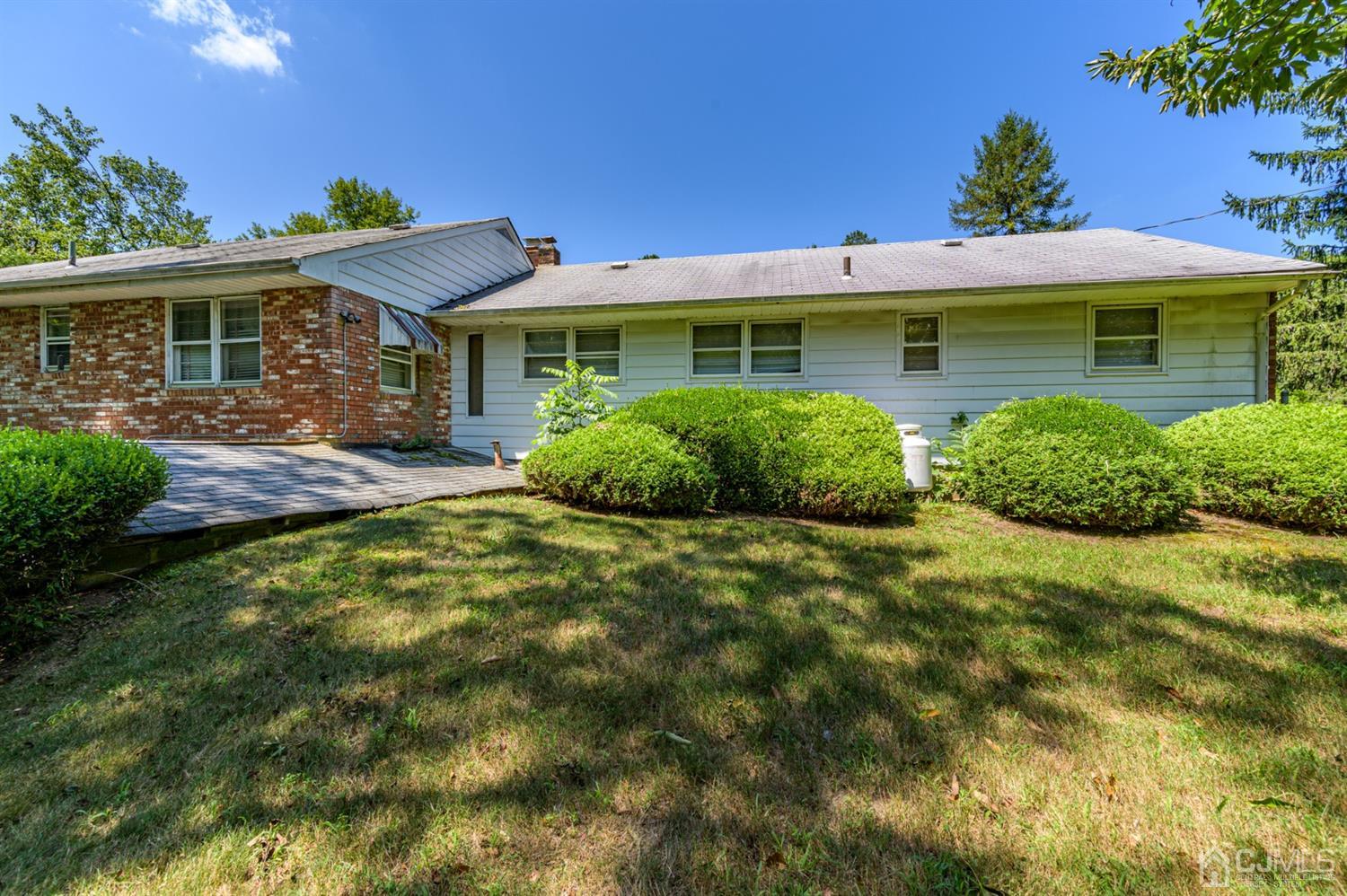 370 East Millstream Road Cream Ridge, NJ 08514 - Photo 51 of 54 a front view of a house with garden