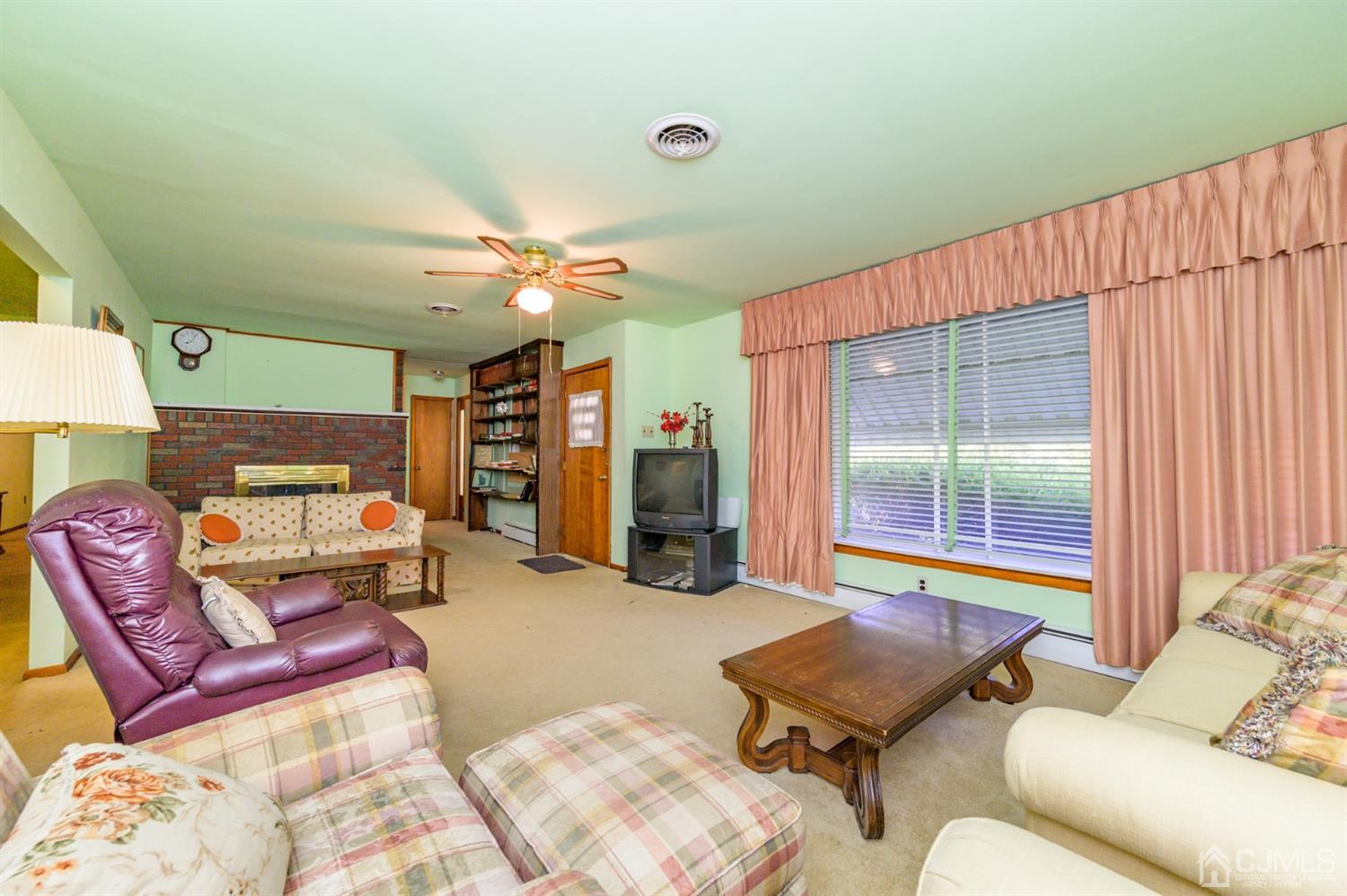 370 East Millstream Road Cream Ridge, NJ 08514 - Photo 9 of 54 a living room with furniture and wooden floor