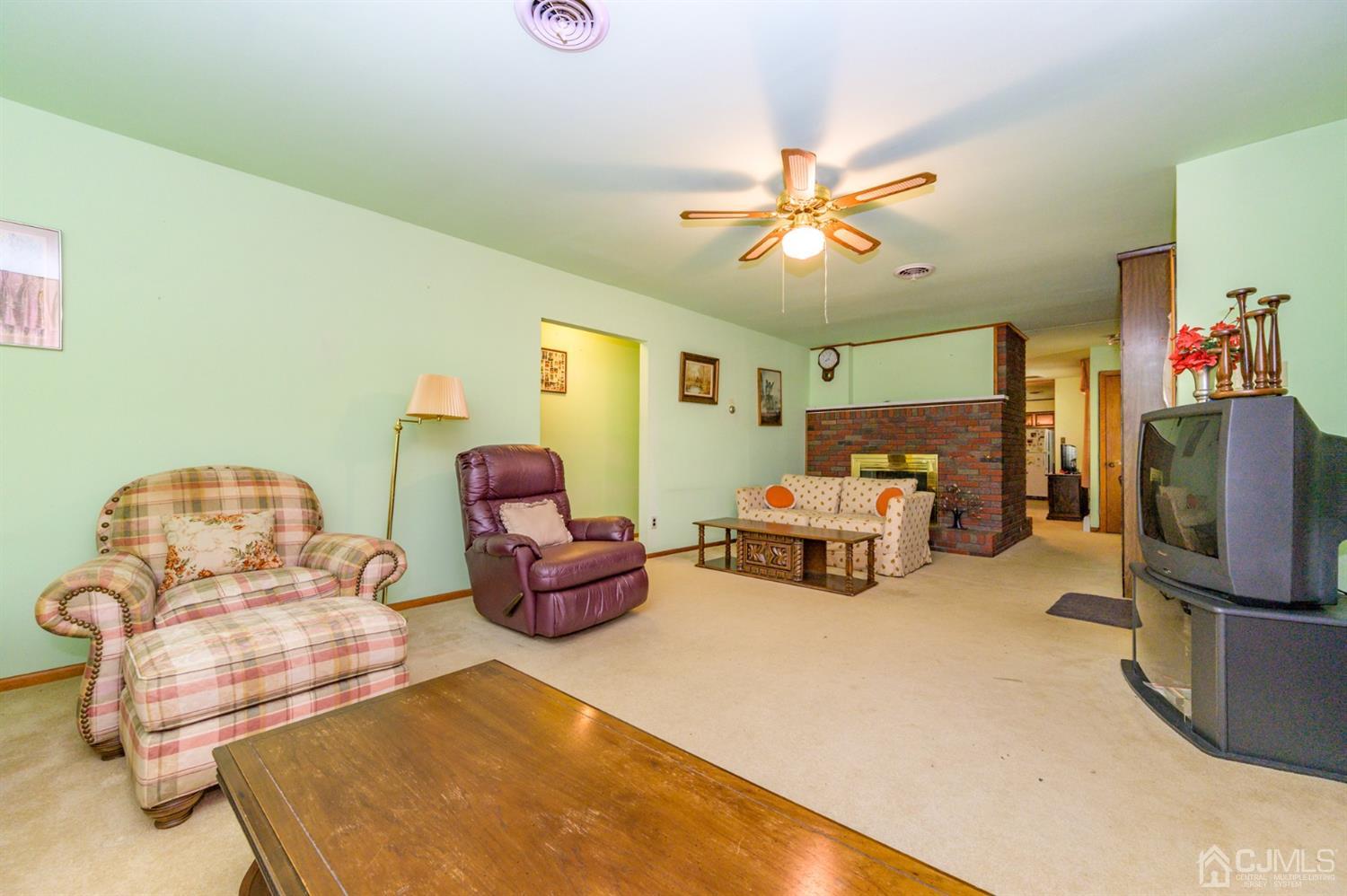 370 East Millstream Road Cream Ridge, NJ 08514 - Photo 10 of 54 a bedroom with furniture and a flat screen tv
