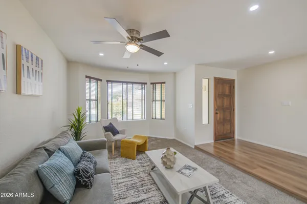a living room with furniture and a table