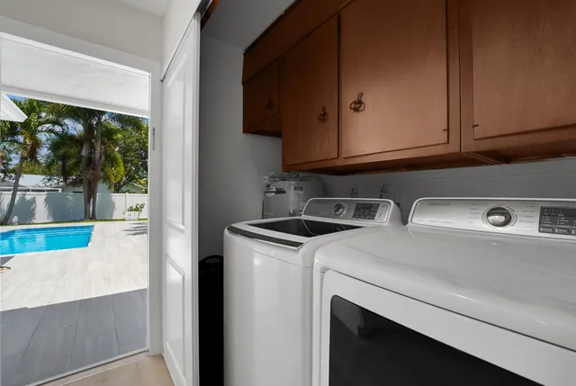 a bathroom with a tub and shower