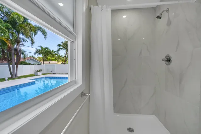 a white bath tub sitting next to a white sink
