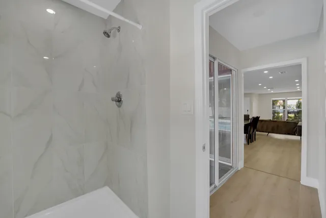 a bathroom with a toilet a sink a vanity and mirror