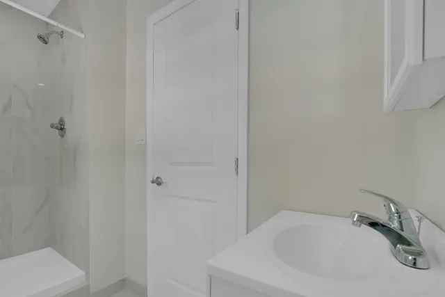 a room with pool table and windows