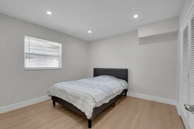a bathroom with a sink mirror and toilet
