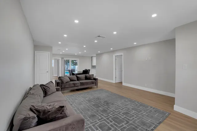 a living room with furniture and a rug